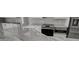 Kitchen with stainless steel appliances, granite countertops, and sleek white cabinetry at 1136 Deardon Dr, Venice, FL 34292