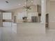 Well appointed kitchen with stainless steel appliances, kitchen island, and white cabinetry at 1136 Deardon Dr, Venice, FL 34292