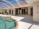 Beautiful screened-in pool with convenient shower and easy access to the home's interior at 1136 Deardon Dr, Venice, FL 34292