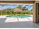 Bright enclosed pool area with a view of the neighborhood, offering a private space for relaxation at 1136 Deardon Dr, Venice, FL 34292