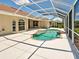 Bright, enclosed pool area with a uniquely shaped pool, ample deck space, and well-manicured landscaping at 1136 Deardon Dr, Venice, FL 34292