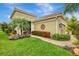 Charming home featuring a paved walkway and verdant landscaping at 11739 Okaloosa Dr, Venice, FL 34293