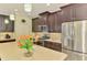 Well-appointed kitchen boasts stainless steel appliances, granite countertops, and ample cabinet space, a chef's dream at 11739 Okaloosa Dr, Venice, FL 34293