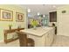 Kitchen island with granite counters, stainless appliances, and bar stools for a casual dining experience at 11739 Okaloosa Dr, Venice, FL 34293