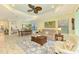Spacious living room flowing into dining area, featuring stylish furnishings and a cohesive design at 11739 Okaloosa Dr, Venice, FL 34293