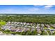 Scenic aerial view of a residential neighborhood featuring well-maintained homes and lush green landscaping at 11819 Tempest Harbor Loop, Venice, FL 34292