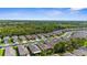 An aerial view showcases a well-designed community with lush landscapes, sidewalks, and diverse home styles, creating an inviting neighborhood at 11819 Tempest Harbor Loop, Venice, FL 34292