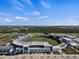 Aerial view of a well-maintained baseball stadium with lush green fields and a clear blue sky at 11819 Tempest Harbor Loop, Venice, FL 34292