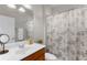 Bathroom featuring a single vanity and tub with a decorative shower curtain at 11819 Tempest Harbor Loop, Venice, FL 34292