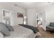Light-filled bedroom with wood floors, ensuite bathroom access, and sitting area at 11819 Tempest Harbor Loop, Venice, FL 34292
