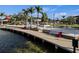 Lakeside boardwalk featuring benches and waterfront views, perfect for relaxing and enjoying the scenery at 11819 Tempest Harbor Loop, Venice, FL 34292
