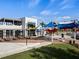 Oak and Stone restaurant features outdoor seating and a stylish exterior design at 11819 Tempest Harbor Loop, Venice, FL 34292