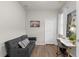 Office with a gray futon, white desk, and natural light from the window at 11819 Tempest Harbor Loop, Venice, FL 34292