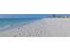 Scenic beach view featuring pristine white sand, clear turquoise water, and gentle waves lapping the shore at 1198 Jamaica Rd, Venice, FL 34293