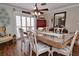 Bright dining room with hardwood floors, a decorative table, and seating for six at 1198 Jamaica Rd, Venice, FL 34293