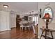 Spacious dining room with hardwood floors, natural light, and modern decor at 1198 Jamaica Rd, Venice, FL 34293