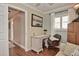 Comfortable home office with a dedicated desk, chair, and sofa, perfect for remote work or study at 1198 Jamaica Rd, Venice, FL 34293
