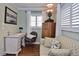 Comfortable home office with a dedicated desk, chair, and sofa, perfect for remote work or study at 1198 Jamaica Rd, Venice, FL 34293