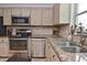 Kitchen featuring stainless steel appliances, ample counter space, and neutral cabinets at 1198 Jamaica Rd, Venice, FL 34293