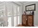 Stylish living room space with plantation shutters and tasteful decor, ideal for both relaxation and entertaining at 1198 Jamaica Rd, Venice, FL 34293
