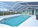 Inviting screened-in pool area with ample space for relaxation and entertaining with convenient access to the home at 1198 Jamaica Rd, Venice, FL 34293