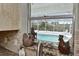 Inviting pool view from the kitchen window, offering a glimpse of the backyard oasis at 1198 Jamaica Rd, Venice, FL 34293