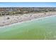 Expansive aerial view of Venice beach featuring beachgoers, ocean views, and lifeguard stands at 1211 Capri Isles Blvd # 6, Venice, FL 34292