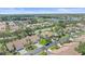 Aerial view showcasing lush landscaping, serene streets and beautiful villas in a vibrant residential neighborhood at 1211 Capri Isles Blvd # 6, Venice, FL 34292