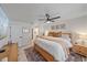 Inviting bedroom with a comfortable bed, wooden accents, and modern decor at 1211 Capri Isles Blvd # 6, Venice, FL 34292