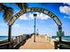 Venice Fishing Pier entrance with an arched sign, promising scenic views and angling opportunities at 1211 Capri Isles Blvd # 6, Venice, FL 34292