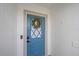 Inviting front door featuring a wreath and smart lock at 1211 Capri Isles Blvd # 6, Venice, FL 34292
