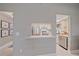 View of the kitchen with stainless steel appliances and a pass-through to the living area at 1211 Capri Isles Blvd # 6, Venice, FL 34292