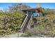 Rustic lifeguard stand nestled among beach dunes with an American flag, offering protection and safety at 1211 Capri Isles Blvd # 6, Venice, FL 34292