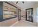 Cozy sunroom with large windows, opening to a living room, with tiled flooring and natural light at 1211 Capri Isles Blvd # 6, Venice, FL 34292
