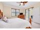 Bright bedroom with window view and lanai access from sliding glass doors at 12187 Amica Loop, Venice, FL 34293