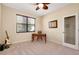 Well-lit bedroom with a ceiling fan, natural light, and functional furniture arrangement at 12187 Amica Loop, Venice, FL 34293