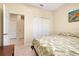Bright bedroom with large closet and tropical-themed decor, offering a cozy retreat at 12187 Amica Loop, Venice, FL 34293