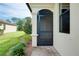 Home entryway with a beautiful decorative glass window at 12187 Amica Loop, Venice, FL 34293