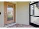 Home entryway featuring a decorative glass front door and a screen door at 12187 Amica Loop, Venice, FL 34293