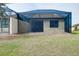 Screened-in lanai area in backyard with partially covered outdoor area at 12187 Amica Loop, Venice, FL 34293