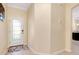 Foyer featuring tiled flooring, glass front door, and natural light at 12187 Amica Loop, Venice, FL 34293