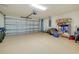 Spacious two car garage with clean epoxy flooring and ample storage space at 12187 Amica Loop, Venice, FL 34293