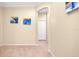 Hallway featuring decorative art and tile flooring at 12187 Amica Loop, Venice, FL 34293