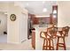 Modern kitchen featuring granite countertops, stainless steel appliances, and stylish breakfast bar seating at 12187 Amica Loop, Venice, FL 34293