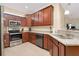 Well-equipped kitchen with stainless steel appliances, granite countertops, and ample storage at 12187 Amica Loop, Venice, FL 34293