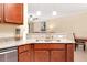 Granite countertops and stainless dishwasher shown in the kitchen at 12187 Amica Loop, Venice, FL 34293