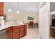Cozy kitchen featuring granite countertops and seamlessly flowing into the dining area at 12187 Amica Loop, Venice, FL 34293