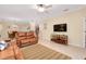 Spacious living area with open floor plan, bar seating, and dining table at 12187 Amica Loop, Venice, FL 34293
