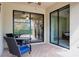 Inviting patio with seating area and seamless access to indoor living spaces and a bedroom through sliding doors at 12187 Amica Loop, Venice, FL 34293