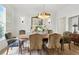 Dining room with wood floors, stylish chairs, and modern chandelier at 1234 Harbor Town Way, Venice, FL 34292